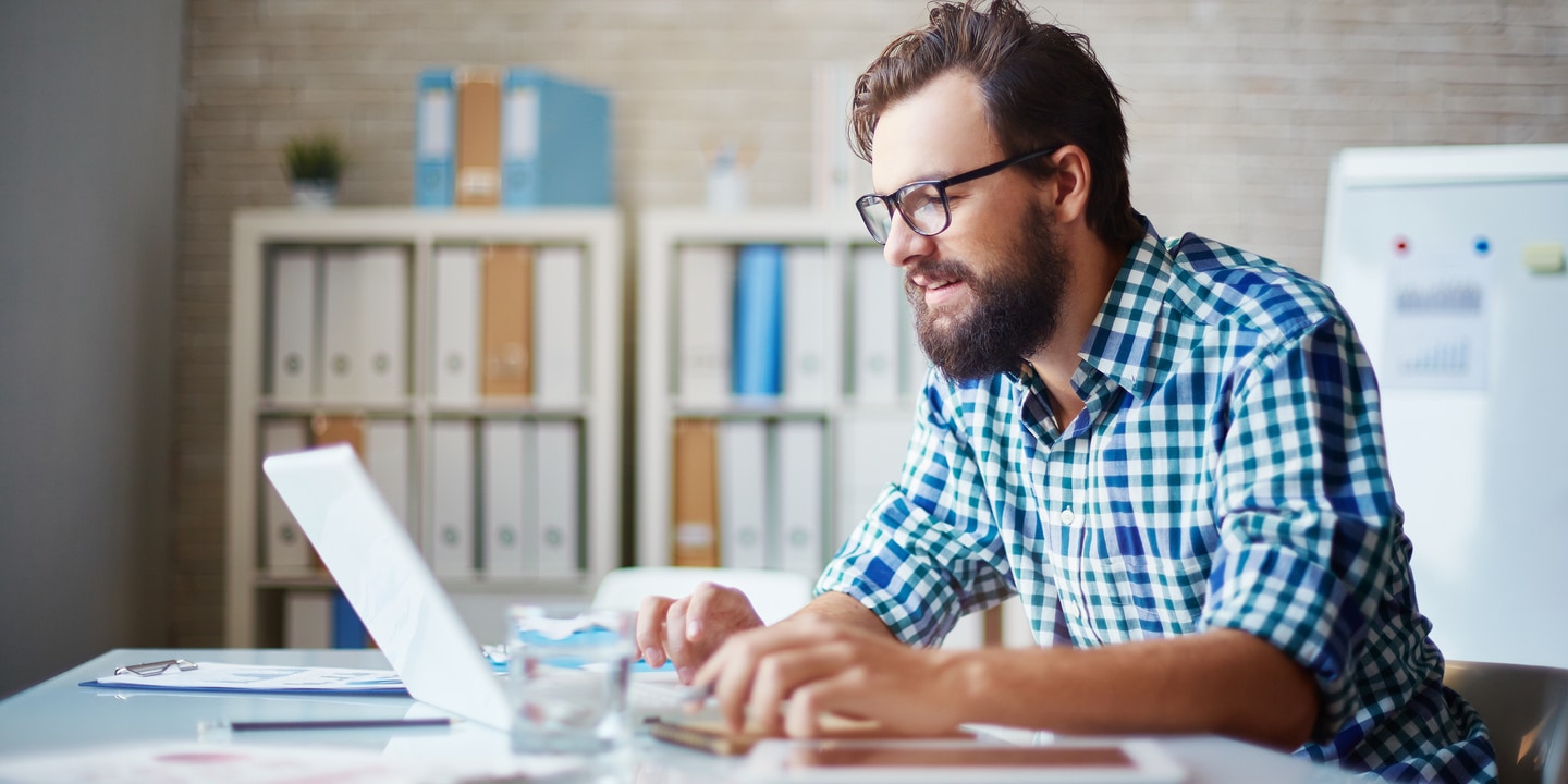 Man working on laptop at a desk