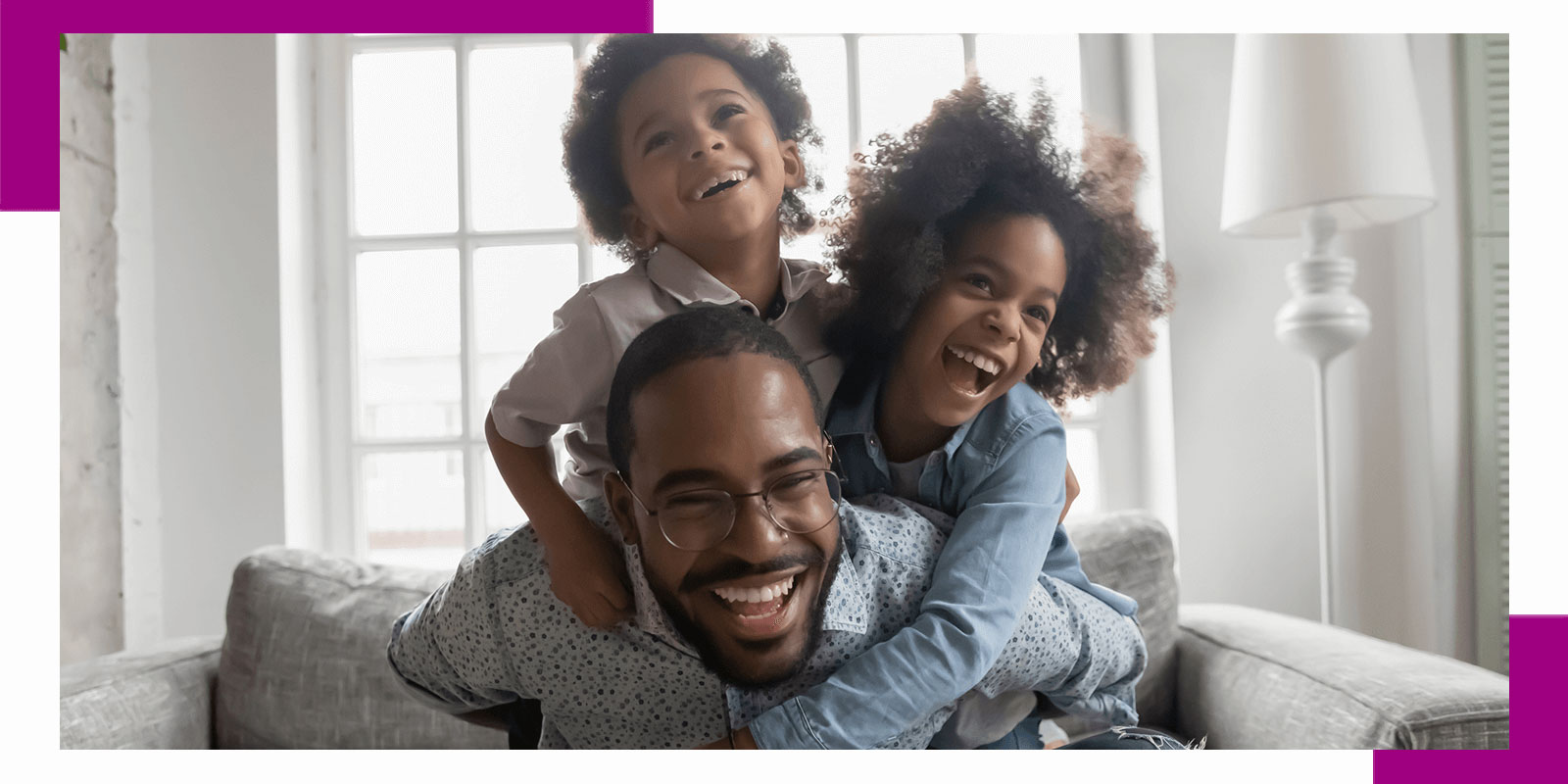 Father with his two children smiling in their living room