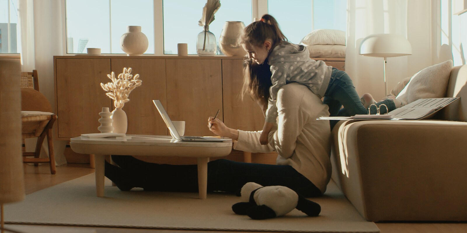 Female and child looking at laptop